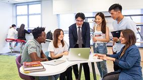 Students and teacher are having discussion