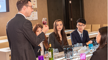 students attending a wine tasting class