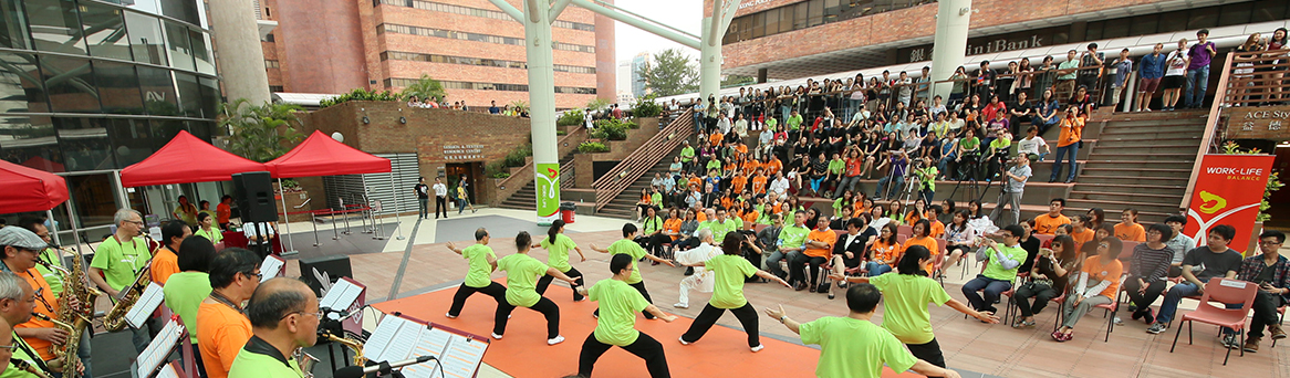 a group of staff performing Taichi and saxophone during lunch period to achieve work life balance
