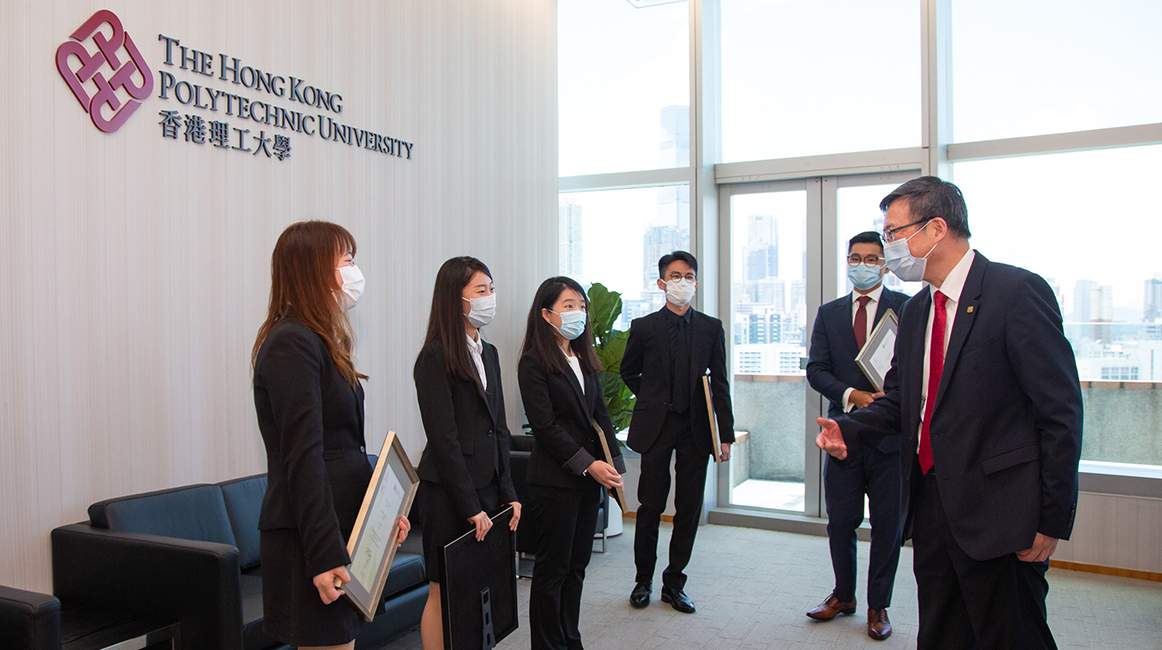 PolyU President Professor Jin-guang Teng talking with awardees