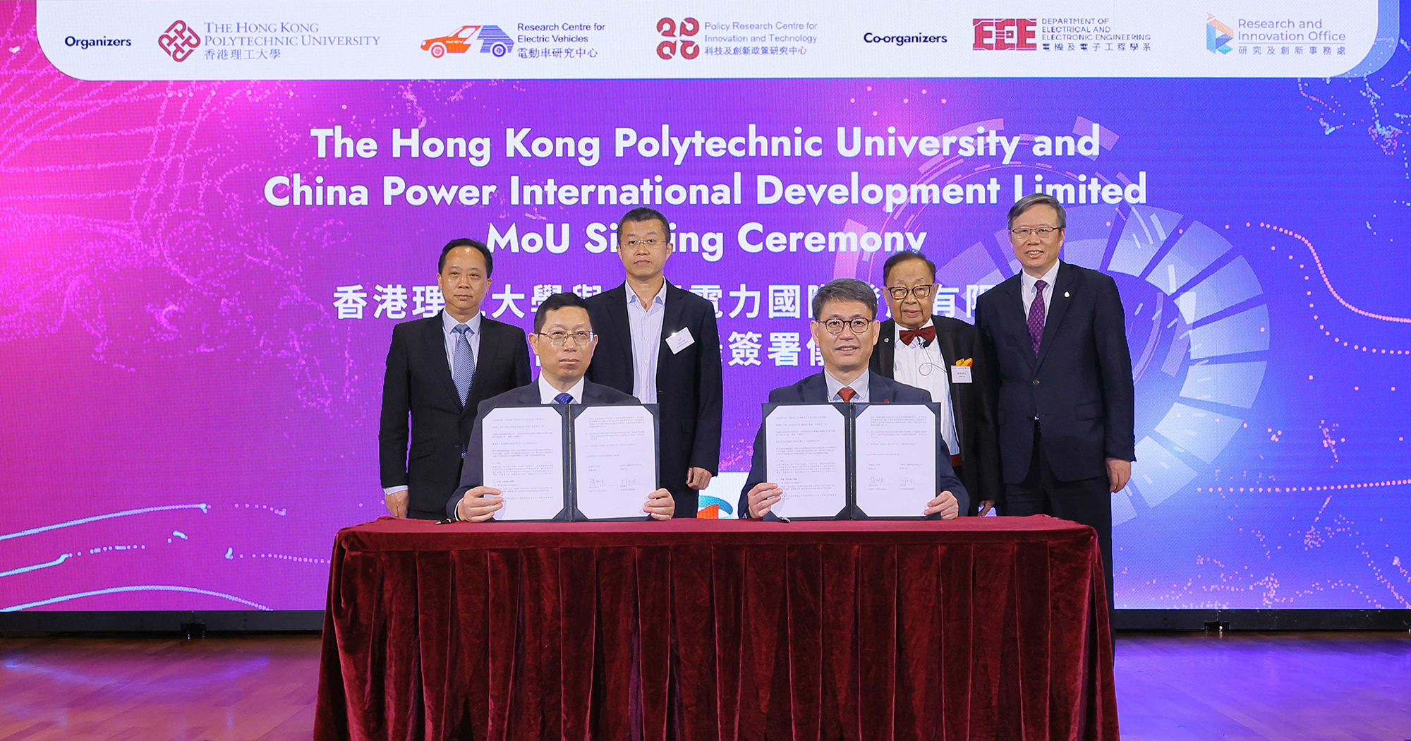 Witnessed by Prof. Jin-Guang Teng, PolyU President (1st from right, back row); Prof. C.C. Chan, RCEV Director (2nd from right, back row), Mr Ye Shuiqiu, Deputy Director-General, Department of Educational, Scientific and Technological Affairs, Liaison Office of the Central People’s Government in the HKSAR (1st from left, back row); and Mr Chang FANG, Senior Manager, China Power International Development Limited (2nd from left, back row), an MoU was signed by Prof. Christopher Chao, PolyU Vice President (Research and Innovation) and Director of the Policy Research Centre for Innovation and Technology (right, front row) ; and Mr Weikang LIN, General Manager, China Power International Development Limited (left, front row).