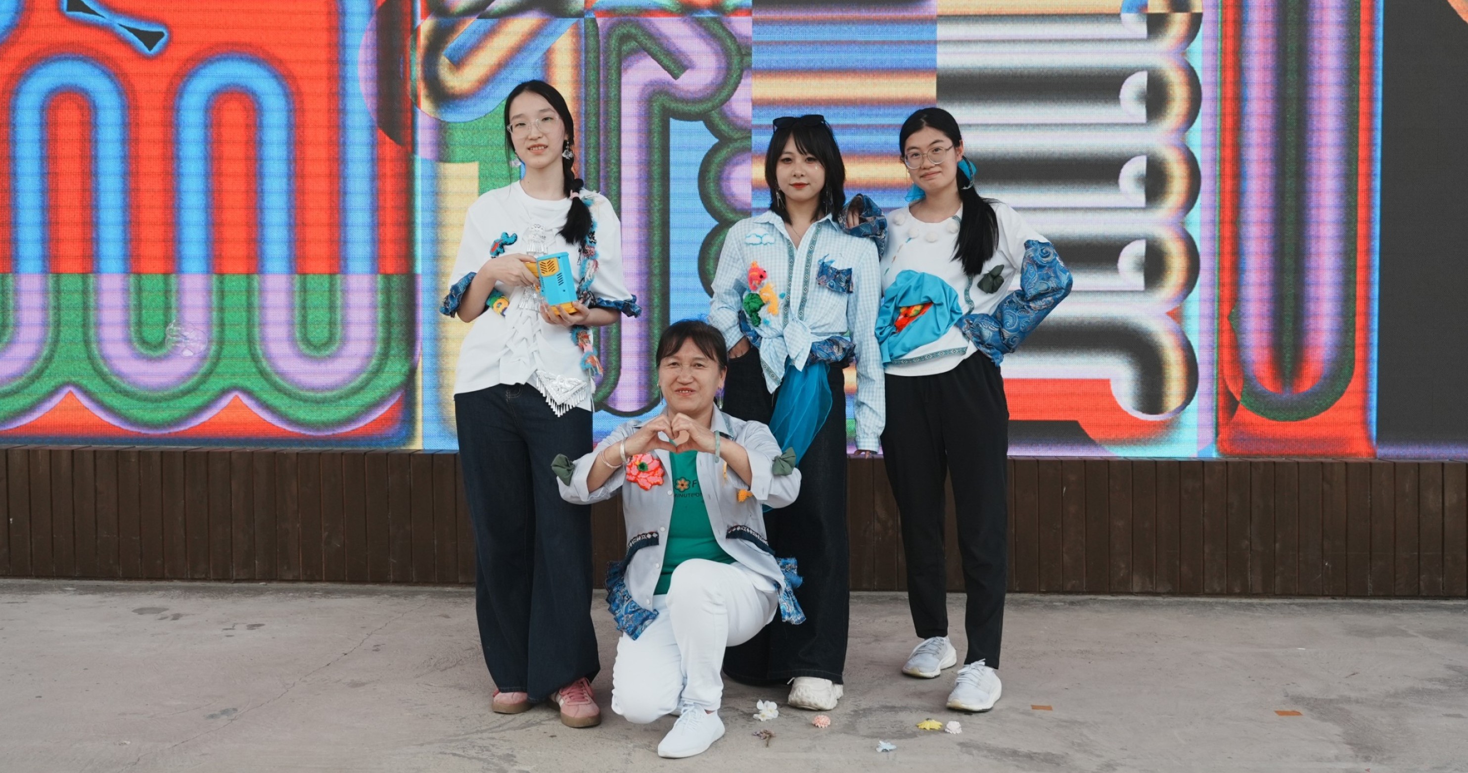 The School of Fashion and Textiles launched a project in which students collaborated with embroidery artists to integrate traditional Zhuang Embroidery techniques into vibrant, contemporary fashion design, promoting the inheritance of intangible cultural heritage.