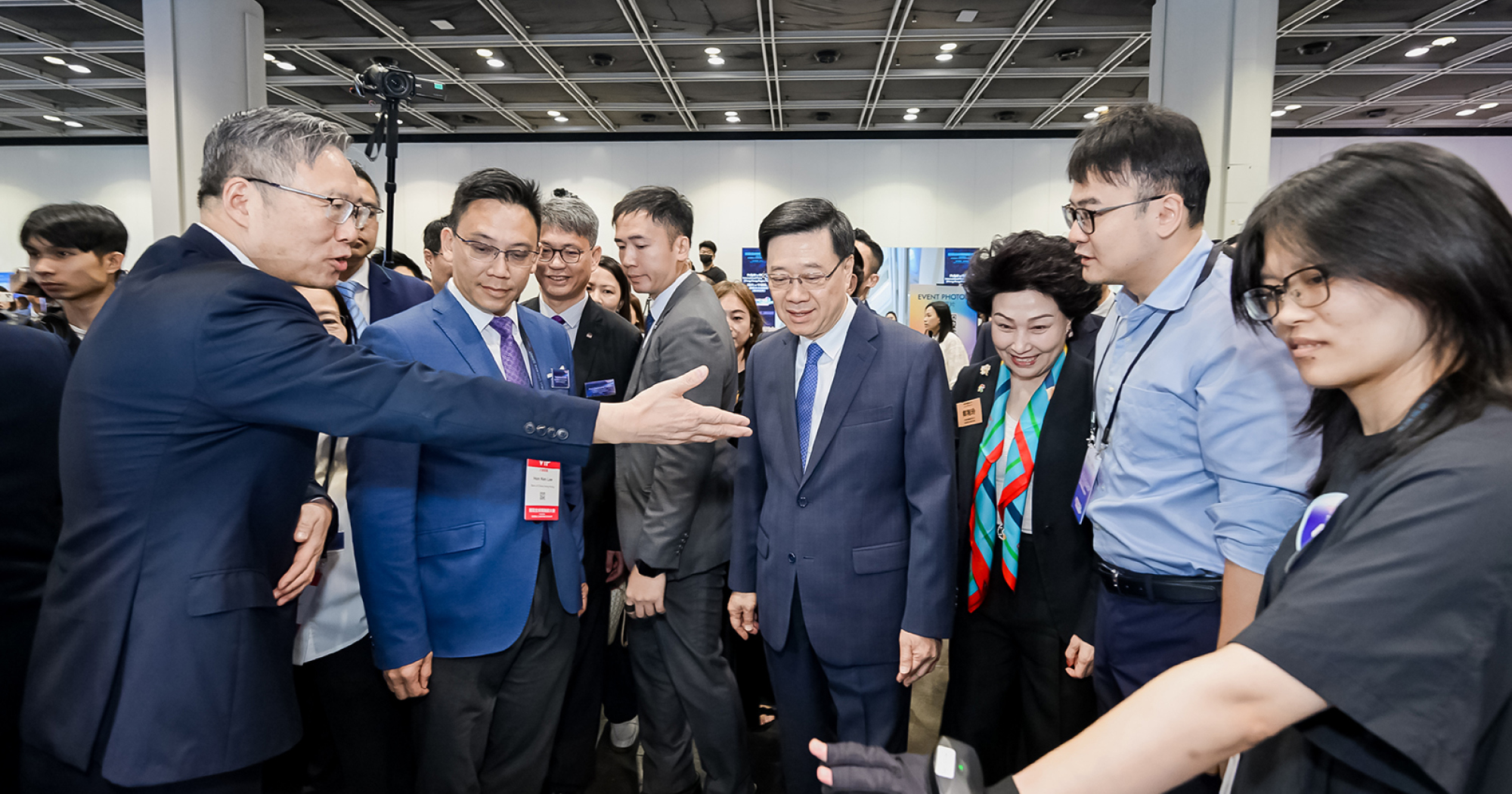Mr John Lee, Chief Executive of the HKSAR (4th from right), visits the exhibition at the “PolyU x BOCHK International Future Challenge 2026” and receives briefings from shortlisted startup teams on their innovative solutions.