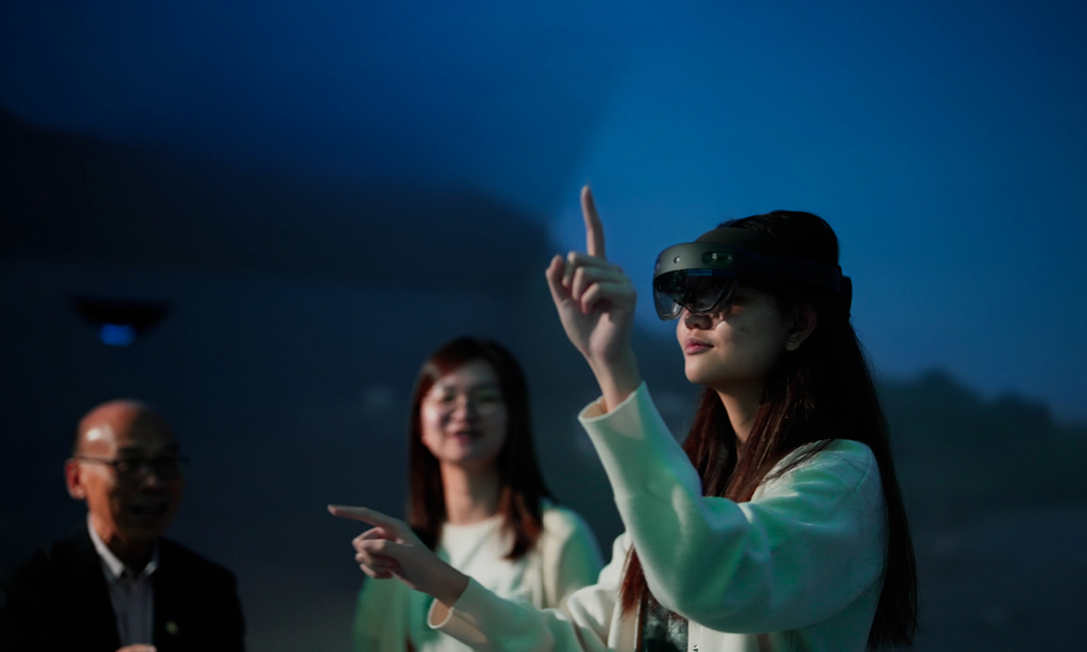 student helpers trying out EdTech equipments when the HiVE was opened in 2023