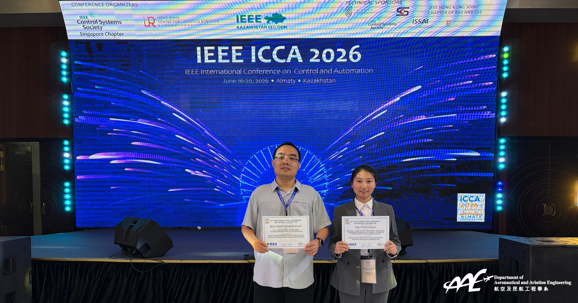 A photo of Dr Li Yu (left) and Ms Xiong Wei (right) at the 20th IEEE ICCA 2026.