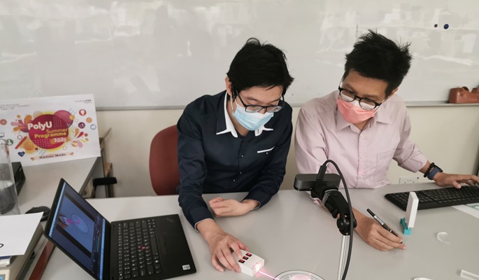 2 teachers demonstrate refraction for online class