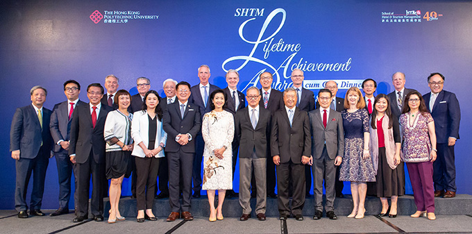 Mr and Mrs Donavanik (front row, middle), PolyU Council Chairman Mr Chan Tze-ching and Dean of SHTM Professor Kaye Chon (front row, 5th and 8th from right), with distinguished guests at the gala event.