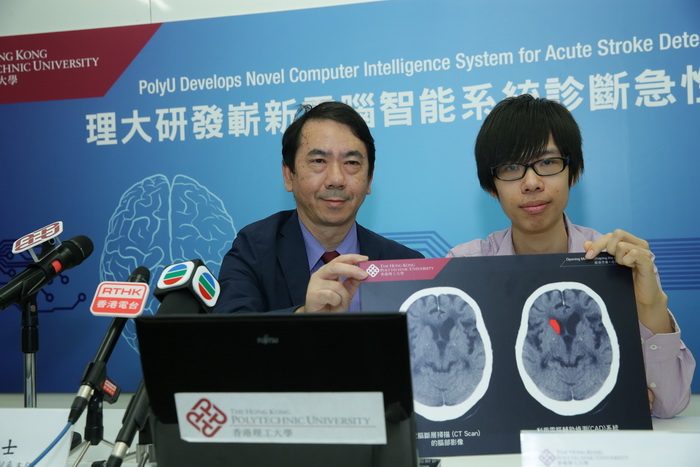 Student (right) of Dr. Tang participates in the research of new system. 
