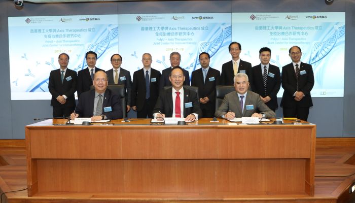 PolyU Council Chairman Mr Tze-ching CHAN; Professor Timothy W. TONG, President of PolyU (5th & 3rd from right, back row) joined other guests to witness the MoU signing for establishing the PolyU—Axis Therapeutics Joint Center for Immunotherapy 