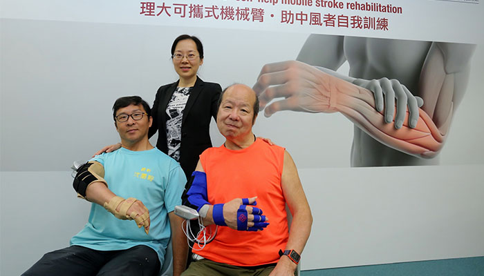Two stroke patients have satisfactory rehabilitation progress after participating in the trial of the robotic arm developed by the team led by Dr Hu Xiao-ling (centre). 