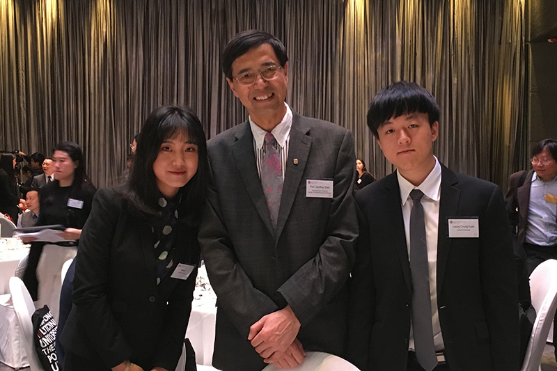 Prof Shen middle with 2 student ambassadors