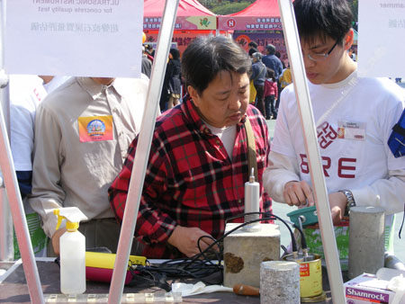 a visitor listening to our student helps demo