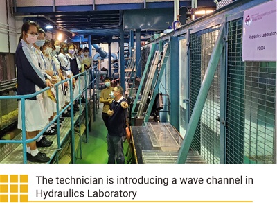 The technician is introducing a wave channel in Hydraulics Laboratory