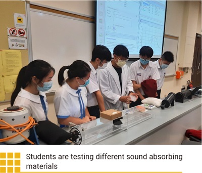 Students are testing different sound absorbing materials