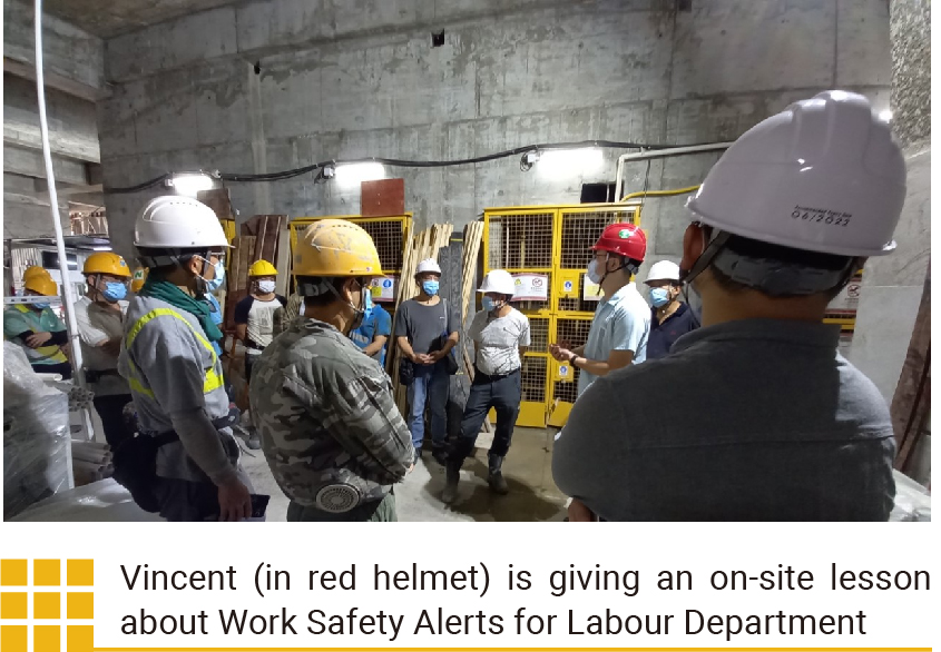 Vincent (in red helmet) is giving an on-site lesson about Work Safety Alerts for Labour Department 