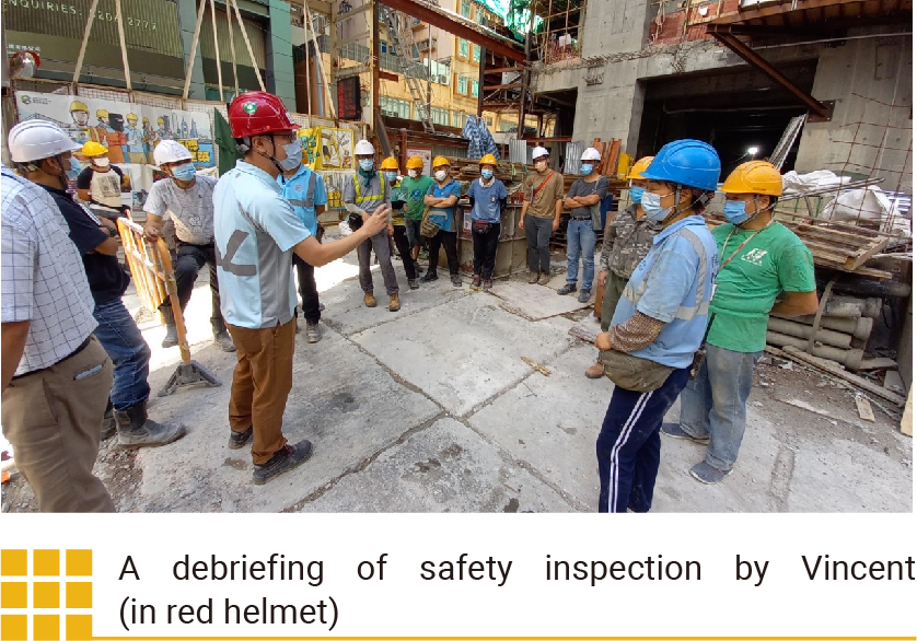 A debriefing of safety inspection by Vincent (in red helmet)