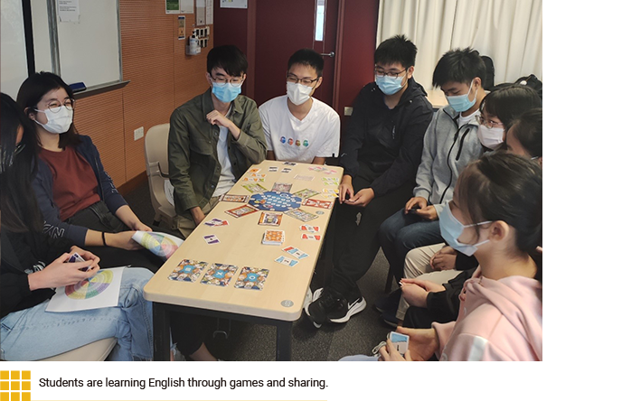 Students are learning English through games and sharing.