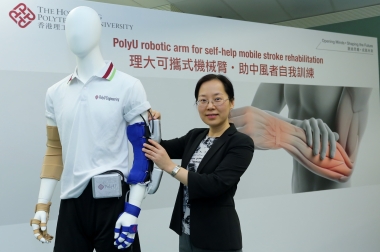 Dr Hu Xiaoling with the exo-neuro-musculo-skeleton