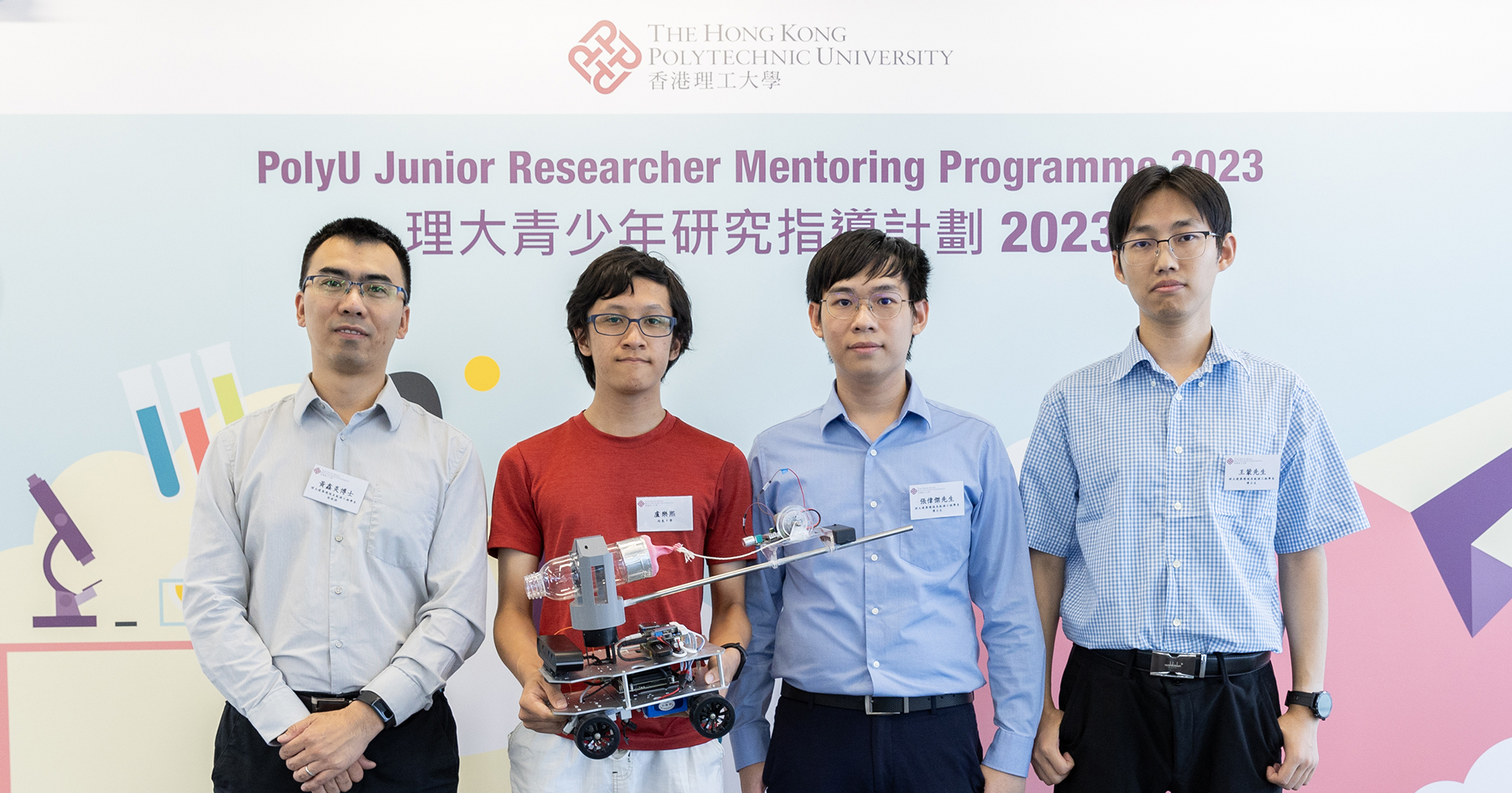 Under the guidance of Dr Xinyan Huang, Associate Professor of PolyU’s Department of Building Environment and Energy Engineering (BEEE) (1st from left) , Mr Meng Wang (1st from right) and Mr Wilson Cheung (2nd from right), BEEE PhD students , a student from West Island School conducted research project “Smart Firefighting with AI and Robots”.