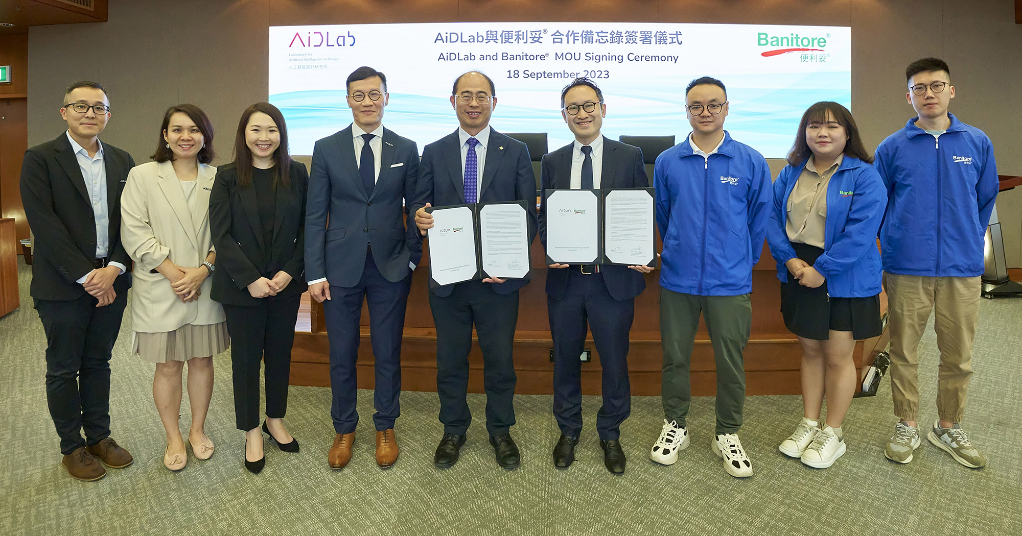 Prof. Wing-tak Wong, AiDLab’s Chairman of Board of Directors and Deputy President and Provost of The Hong Kong Polytechnic University (5th from left), Prof. Calvin Wong, CEO and Centre Director of AiDLab (4th from left), Mr Martin Li, Executive Director of Banitore®  (4th from right), Mr Felix Kwan, Manager of Banitore® (3rd from right),  with other guests witnessed the successful implementation of Hong Kong’s research achievement, marking the commercialisation of the innovative “AI-based Textile Inspection System” (AiTIS).