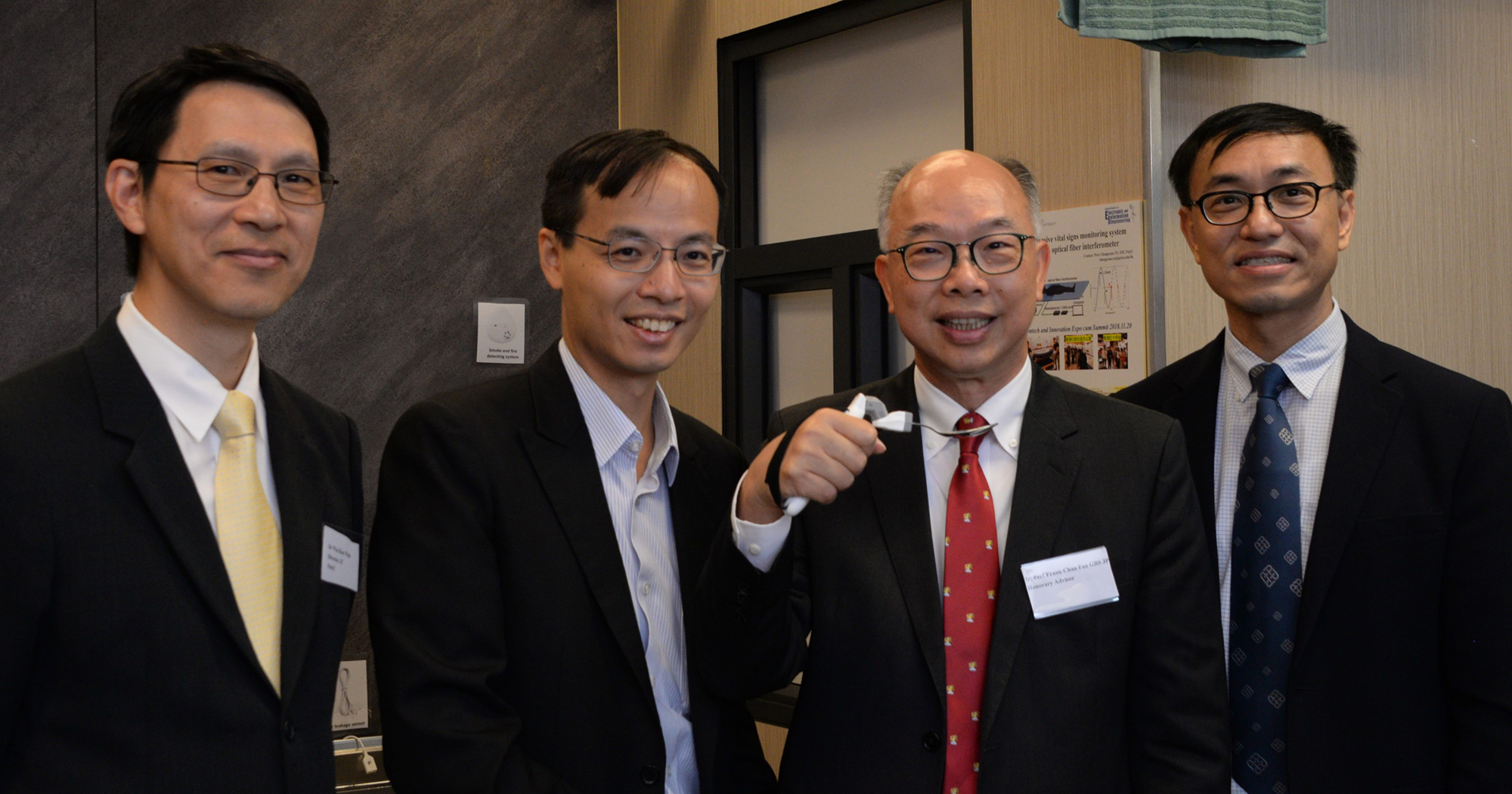 Prof. Frank CHAN Fan, Honorary Advisor of RCATech, (2nd from right) tried the “Snaker Spoon” at the Smart Elderly Home with Dr Hon-wah WAI, Director of Industrial Centre (1st from left), Dr Kevin WONG, Senior Engineering Manager (2nd from left) and Prof. Kenneth FONG, Director of RCATech, PolyU (1st from right).