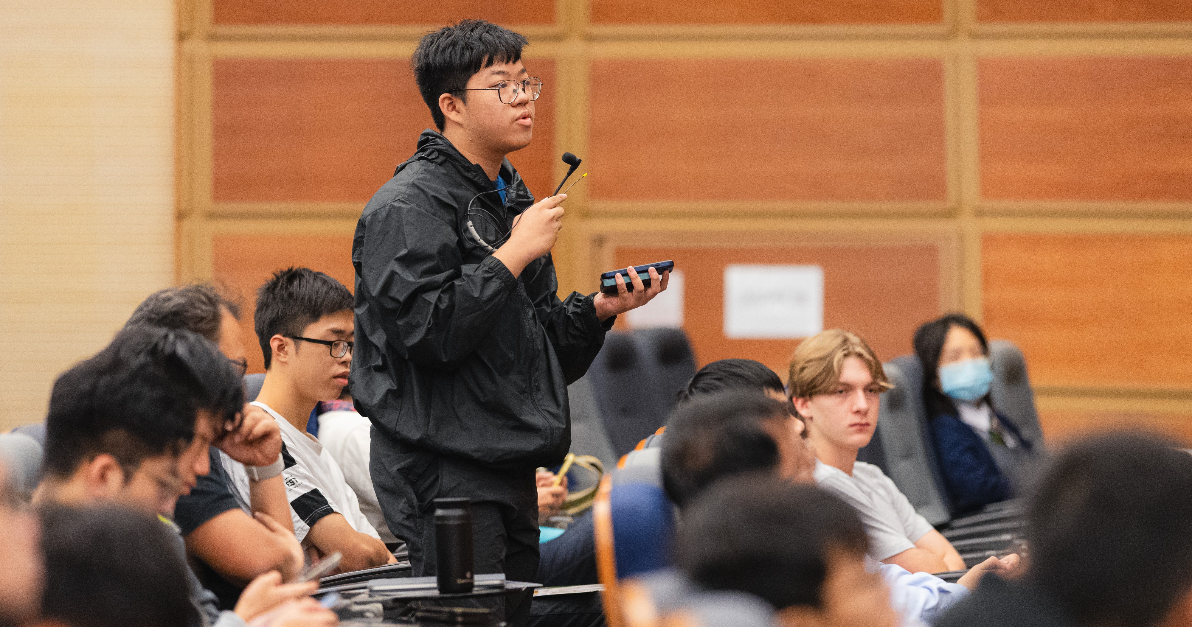 Participating students actively engaged in the lecture Q&A session, demonstrating their keen interest in space exploration.