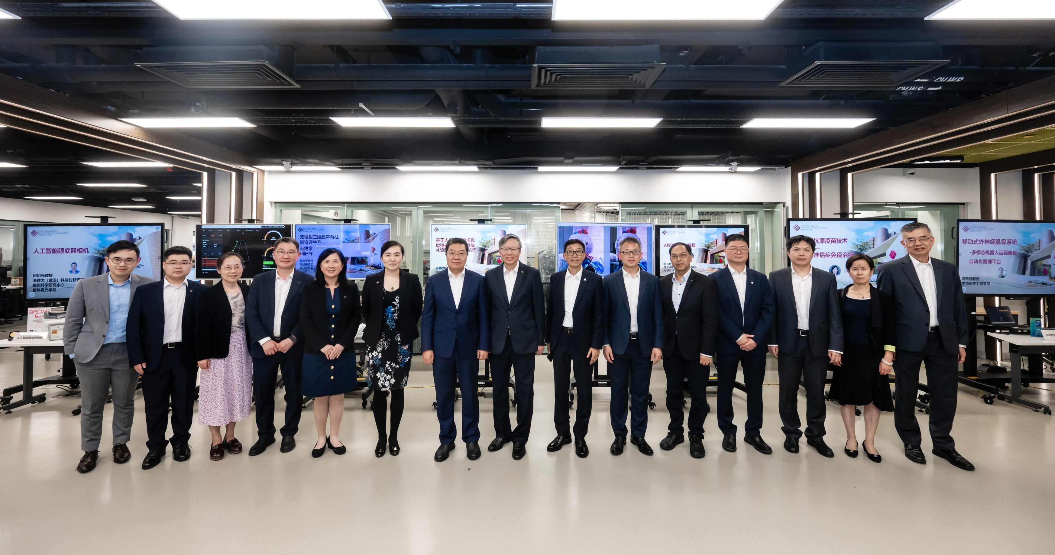 Mr Chen Jiachang (7th from left), Prof. Jin-Guang Teng (centre); Prof. Cao Jiannong (7th from right); Prof. Chen Qingyan, Director of the PolyU Academy for Interdisciplinary Research (1st from right); Prof. Wu Yan (2nd from right); Mr Thomas Li, Assistant Commissioner (Policy and Development) for Innovation and Technology of the HKSAR Government (1st from left), were joined by the PolyU scholars who presented their research projects. They included Prof. Yang Hongxia, Executive Director of the PolyU Academy for Artificial Intelligence, Associate Dean (Global Engagement) of the Faculty of Computer and Mathematical Sciences and Professor of the Department of Computing (6th from left); Prof. Cai Jing, Head and Professor of the Department of Health Technology and Informatics (6th from right); Prof. Zhao Yanxiang, Associate Head and Professor of the Department of Applied Biology and Chemical Technology (5th from left); Prof. Zheng Yongping, Henry G. Leong Professor in Biomedical Engineering and Chair Professor of Biomedical Engineering of the Department of  Biomedical Engineering (5th from right); Prof. He Mingguang, Henry G. Leong Professor in Elderly Vision Health and Chair Professor of Experimental Ophthalmology of the School of Optometry (4th from left); Prof. Zhang Lei, Chair Professor of Computer Vision and Image Analysis of the Department of Computing (4th from right); Prof. Hu Xiaoling, Associate Professor of the Department of Biomedical Engineering (3rd from left); Prof. Ma Cong, Associate Professor of the Department of Applied Biology and Chemical Technology and Director of the Marshall Research Centre for Medical Microbial Biotechnology (3rd from right); and Dr Wang Lin, Postdoctoral Fellow of the Department of Mechanical Engineering (2nd from left).