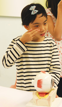 A myopic child demonstrates ortho-K lens wear