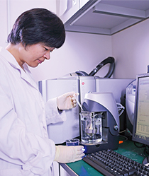 Dr Lu Lin tests the performance of the nano-coating.