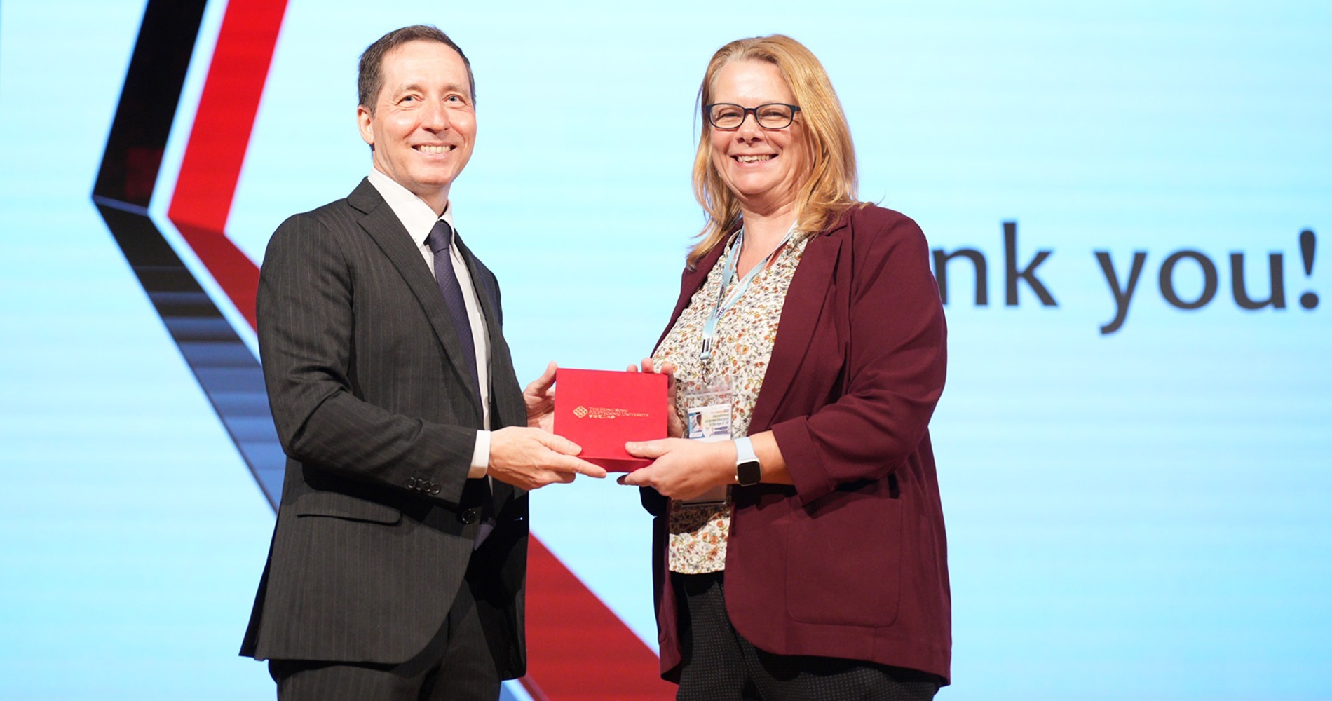 Dr_Jane_Robbins_presents_Prof_Stockwell_with_a_PolyU_souvenir