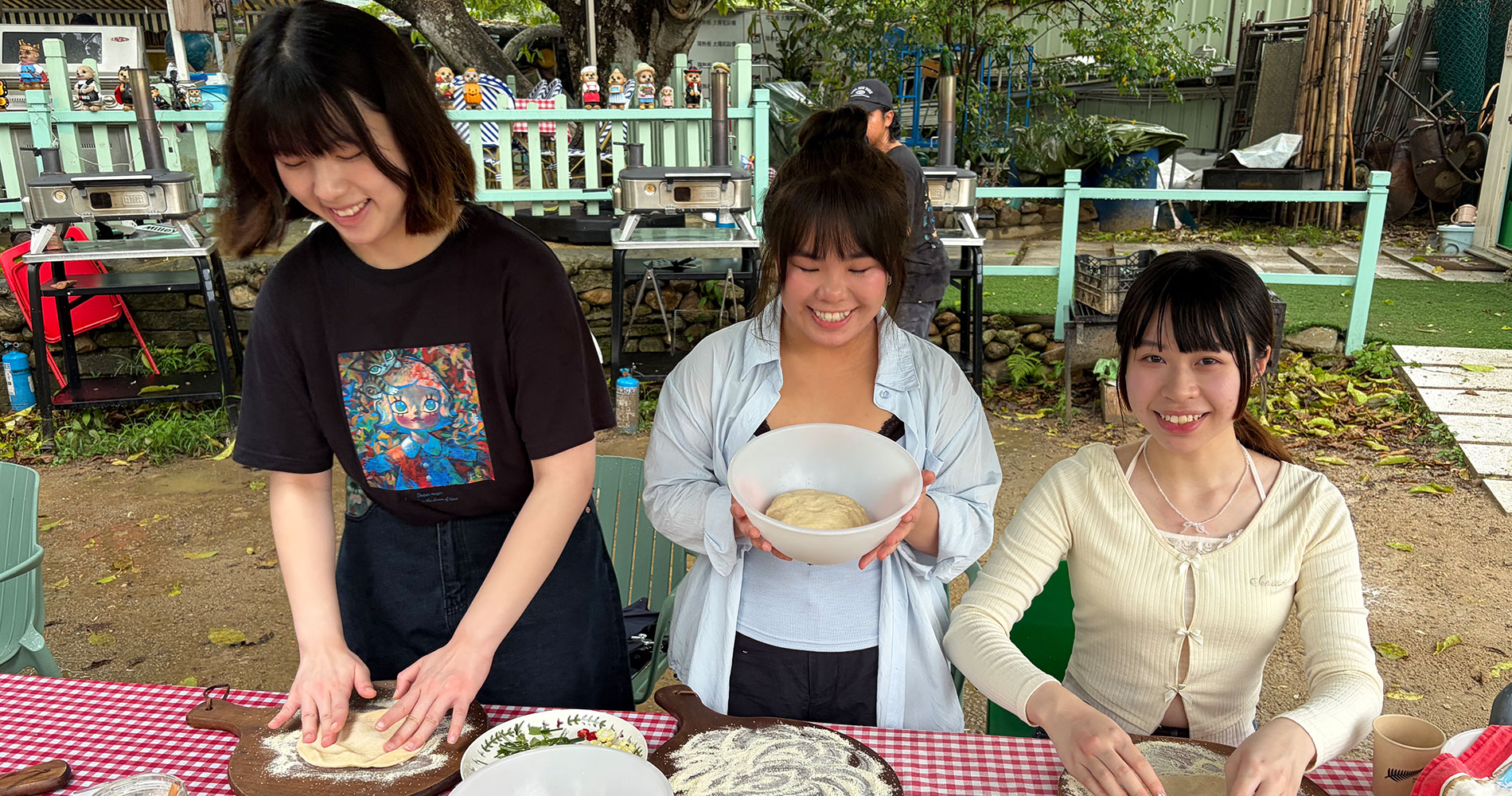 Students rolling the pizza dough