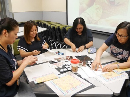 Participants working on their beeswax food wraps