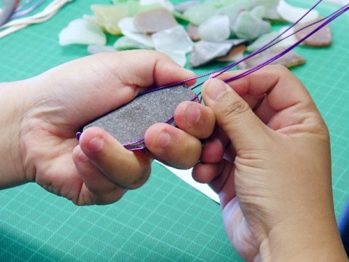 Working on sea glass pieces