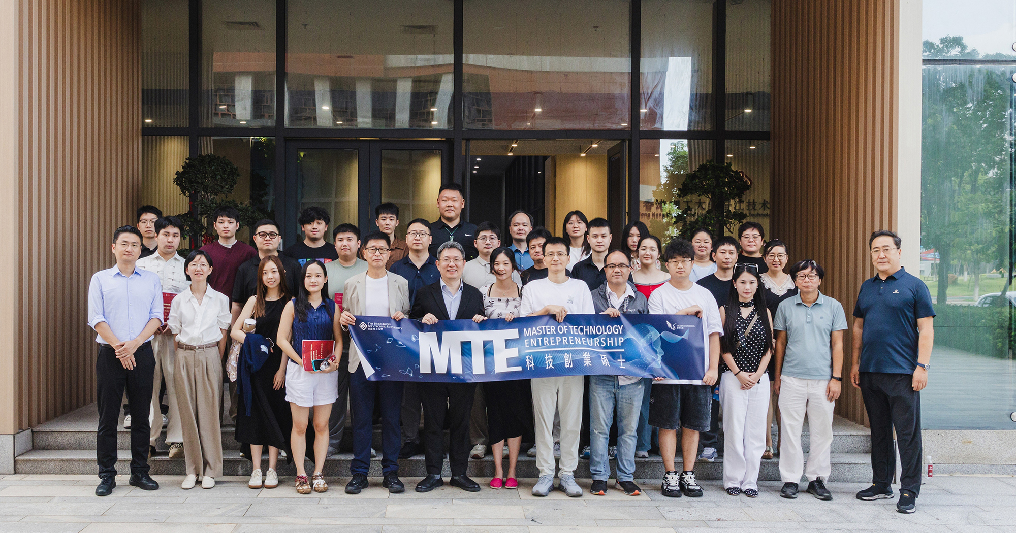 Group photo in front of PolyU-Jinjiang Technology and Innovation Research Institute