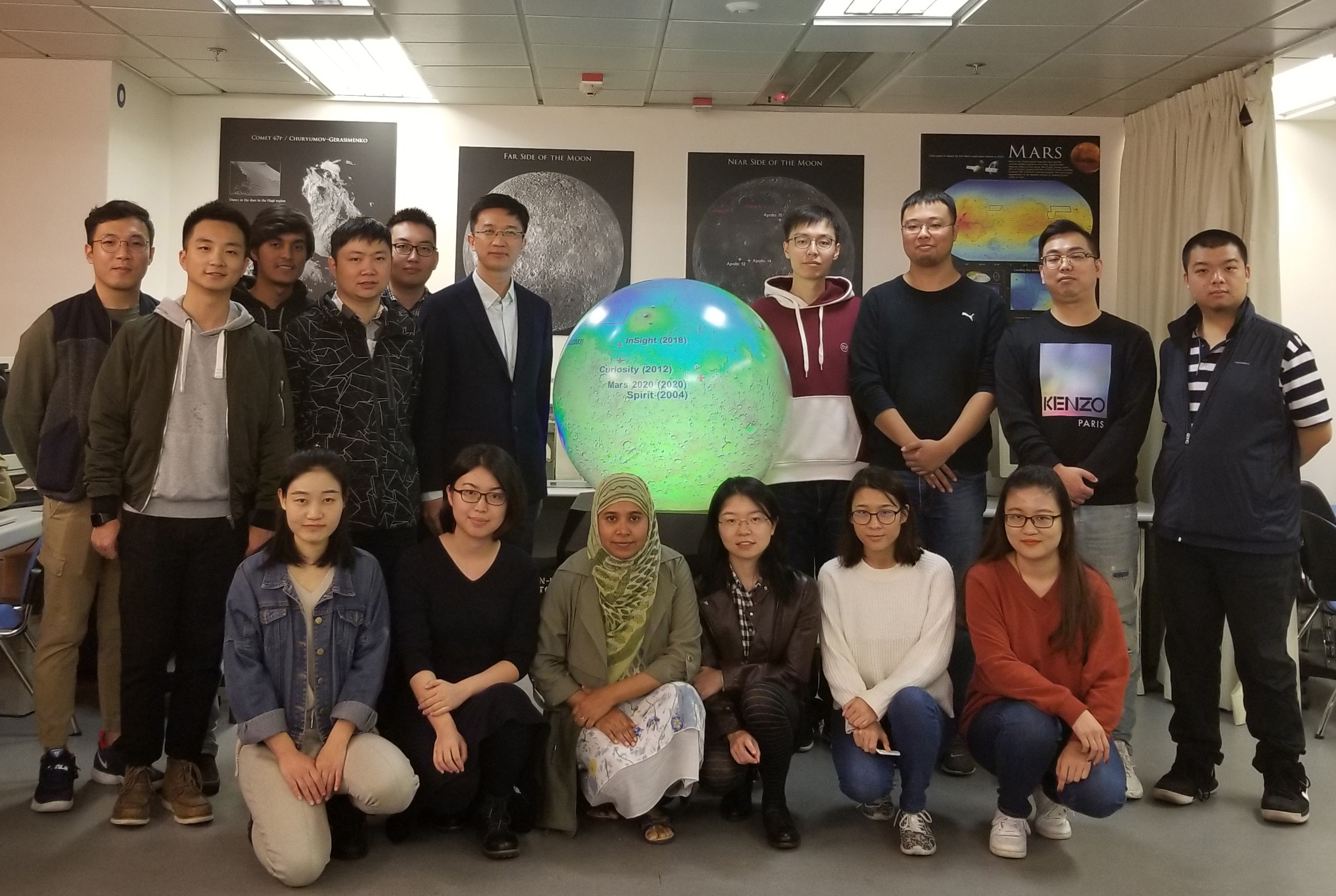 Dr. Morgan Liu (first from right) and the research group under Prof. WU Bo (back row, 6th from left).