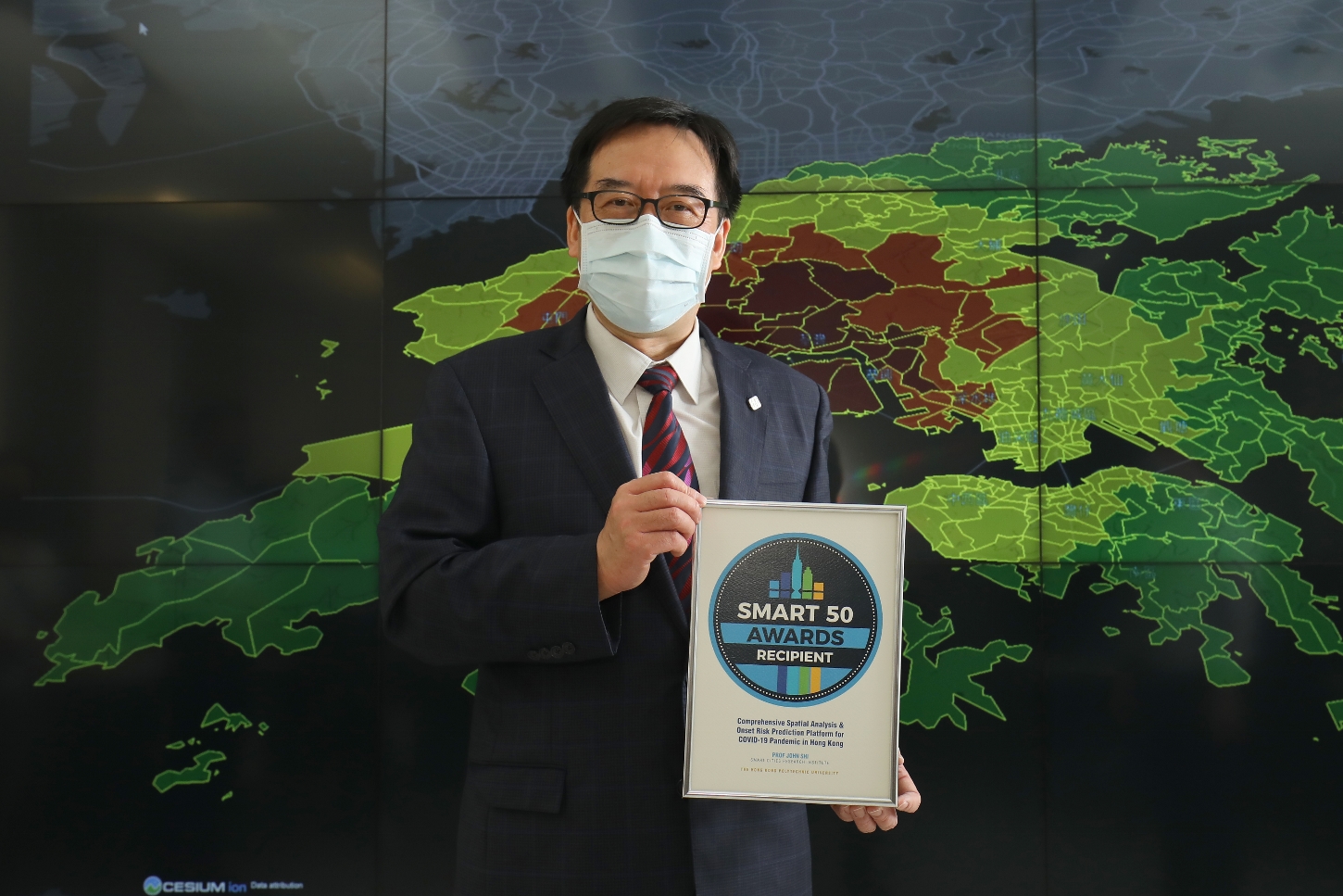 Prof. John Shi with his award