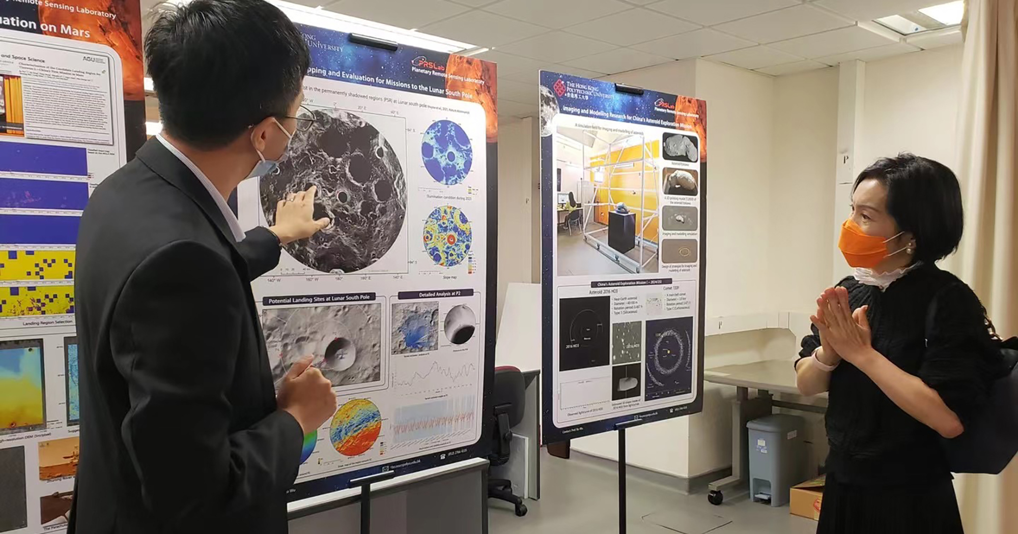 Prof. Wu Bo (left) introduced PolyU’s research in planetary remote sensing to Ms Fiona Cheung (right)