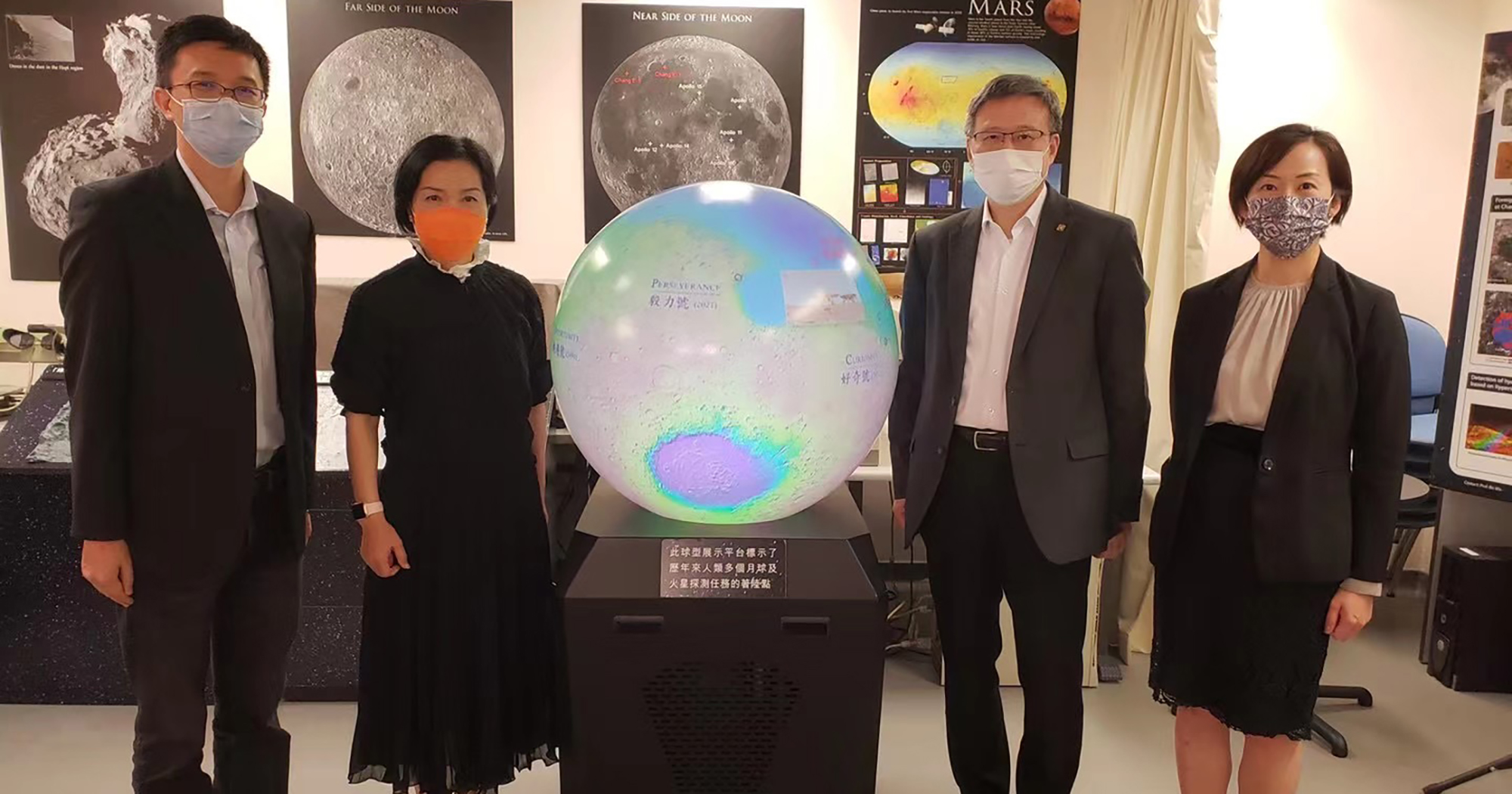 Ms Fiona Cheung (second from left) recently visited PolyU’s Planetary Remote Sensing Laboratory, accompanied by President Prof. Jin-Guang Teng (second from right), Executive Vice President Dr Miranda Lou (far right) and Prof. Wu Bo (far left)