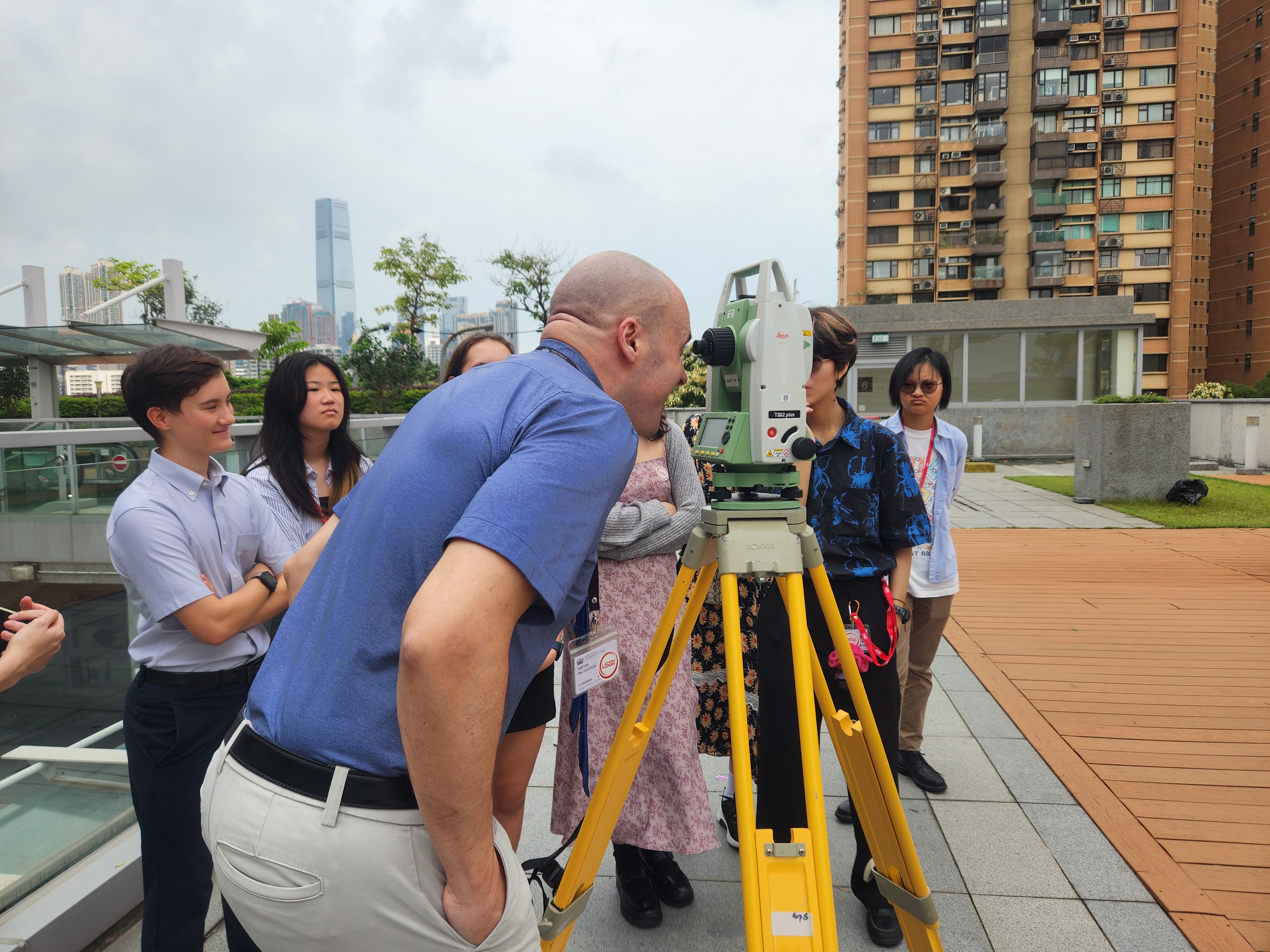 Students and teacher from Nord Anglia International School engaged hands-on with survey equipment.