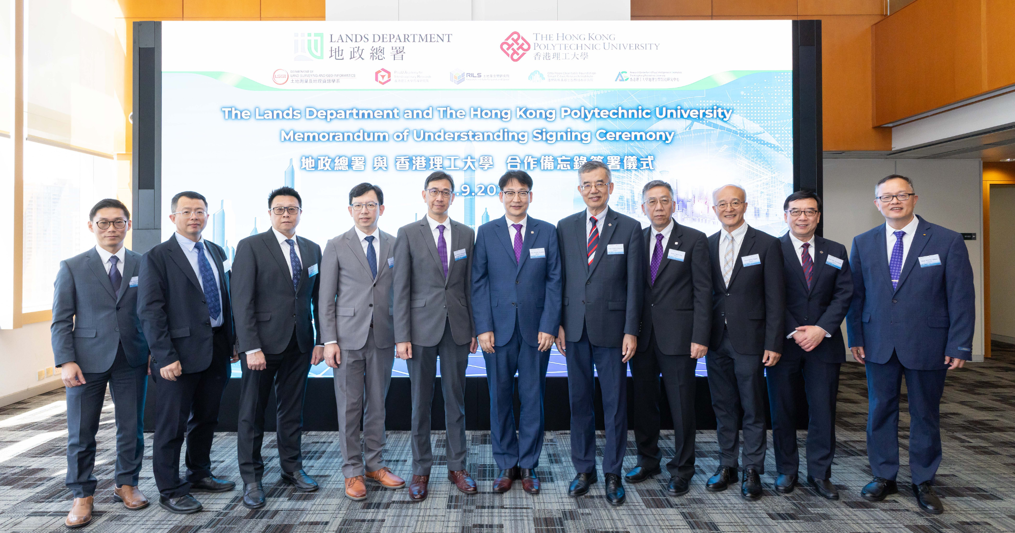 Prof. Wang Zuankai, Associate Vice President (Research and Innovation) of PolyU (centre); Prof. Chen Qingyan, Director of the PolyU Academy for Interdisciplinary Research (5th from right); Prof. Chen Wu, Head of LSGI (4th from right); Prof. Ding Xiaoli, Director of the PolyU Research Institute for Land and Space (3rd from right); Prof. John Shi Wenzhong, Director of the PolyU Otto Poon Charitable Foundation Smart Cities Research Institute (2nd from right); Prof. Weng Qihao, Director of the PolyU Research Centre for Artificial Intelligence in Geomatics (1st from right); along with Mr Chang Kwok-fai (5th from left); Mr Chu Siu-ki, Assistant Director (Survey and Mapping) (4th from left); Mr YEUNG Cheuk-man, Chief Land Surveyor (Technical) (3rd from left); Mr AU Chi-ho, Chief Land Surveyor (Development) (2nd from left); and Mr CHOI Wai-man, Chief Land Surveyor (Land Information Centre) (1st from left) of the Lands Department.