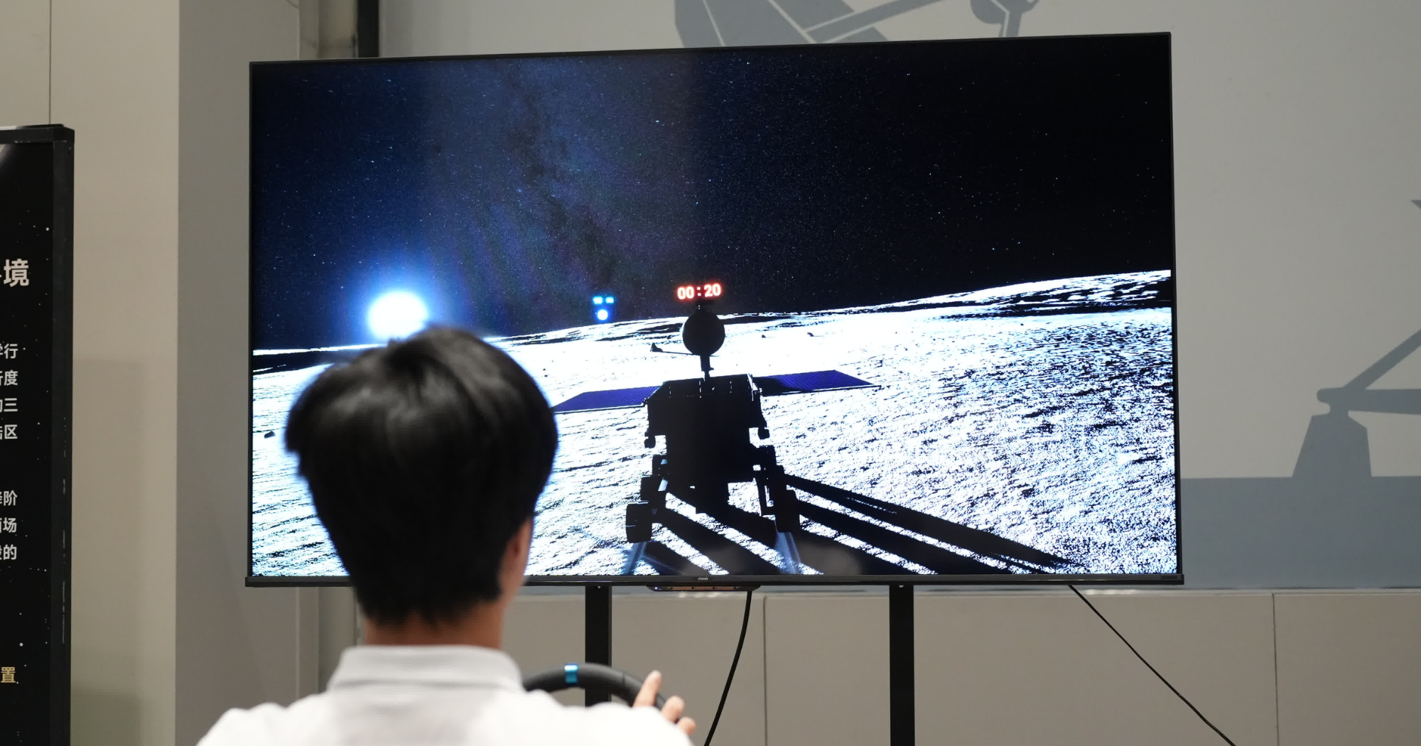 Visitors experience the lunar and Mars landing zone virtual reality system (VR).