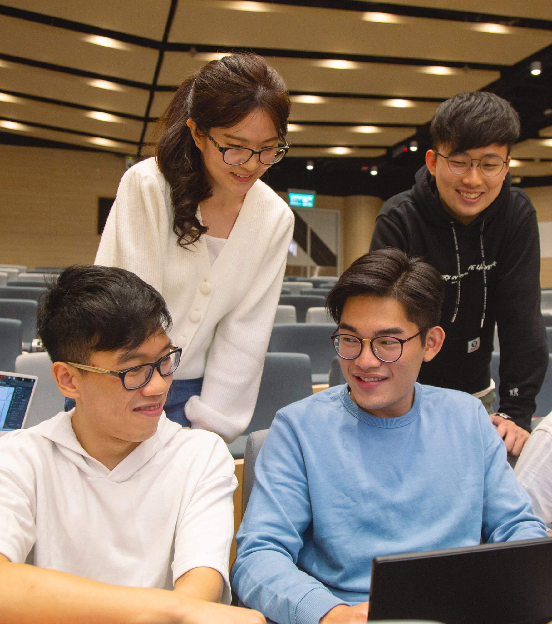 students sit in lecture hall