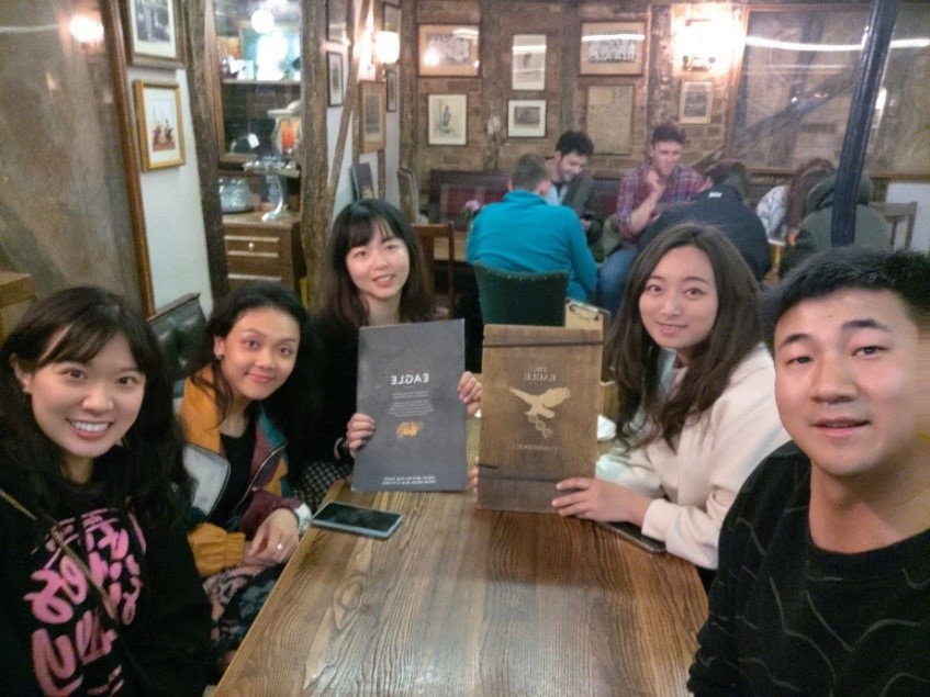 Exchange students from the Hong Kong Polytechnic University gathered at the Eagle pub where the groundbreaking discovery of DNA's structure was unveiled.