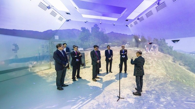 The delegation led by Mr Tim Lui (third from right) visited Hybrid Immersive Virtual Environment and experienced the virtual reality technology used for teaching and learning.