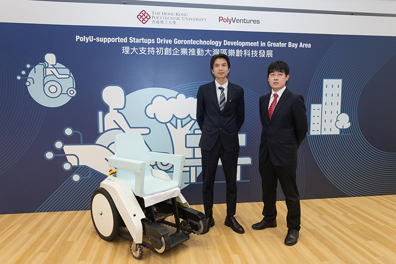 Mr Jojo Xu (left) and Mr Alex Lam (right) , co-founder of Libpet Tech Limited, with the smart all-terrain wheelchair TENK.