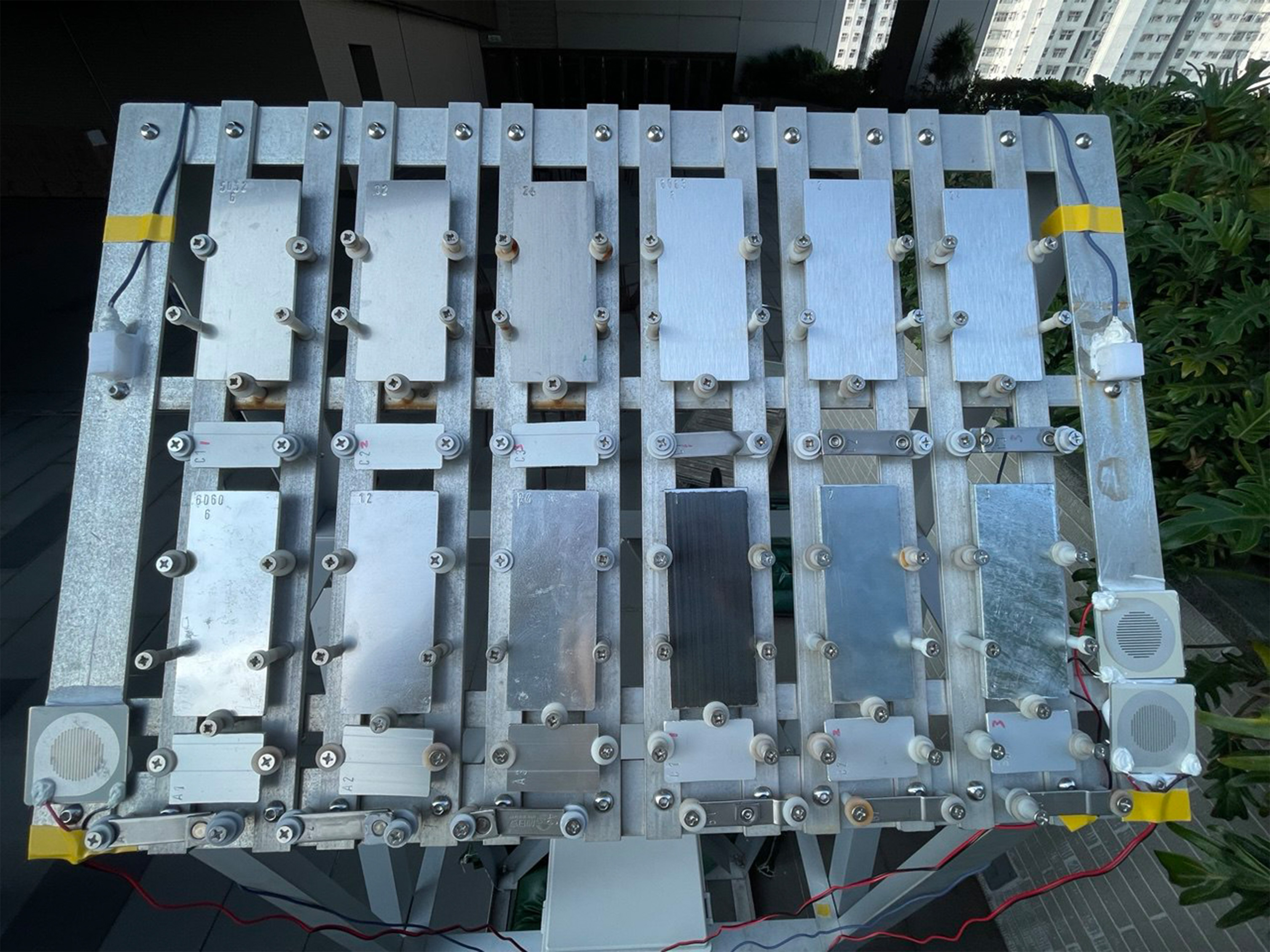 Outdoor exposure tests determine atmospheric corrosion rates of different steel alloys.