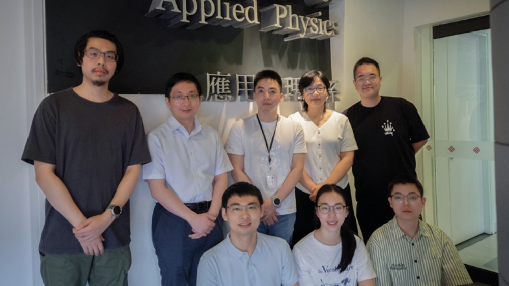 Professor Chai Yang (back, second left) and his team are revolutionising sensory AI by breaking down barriers in power consumption and latency.