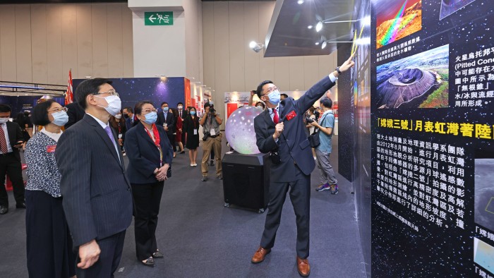 (From left) Prof. Sophia Chan Siu-chee, Secretary for Food and Health; Mr John Lee Ka-chiu, Chief Secretary for Administration; and Ms Teresa Cheng Yeuk-wah, Secretary for Justice, listened to Prof. Wu Bo’s introduction on PolyU’s space technologies.