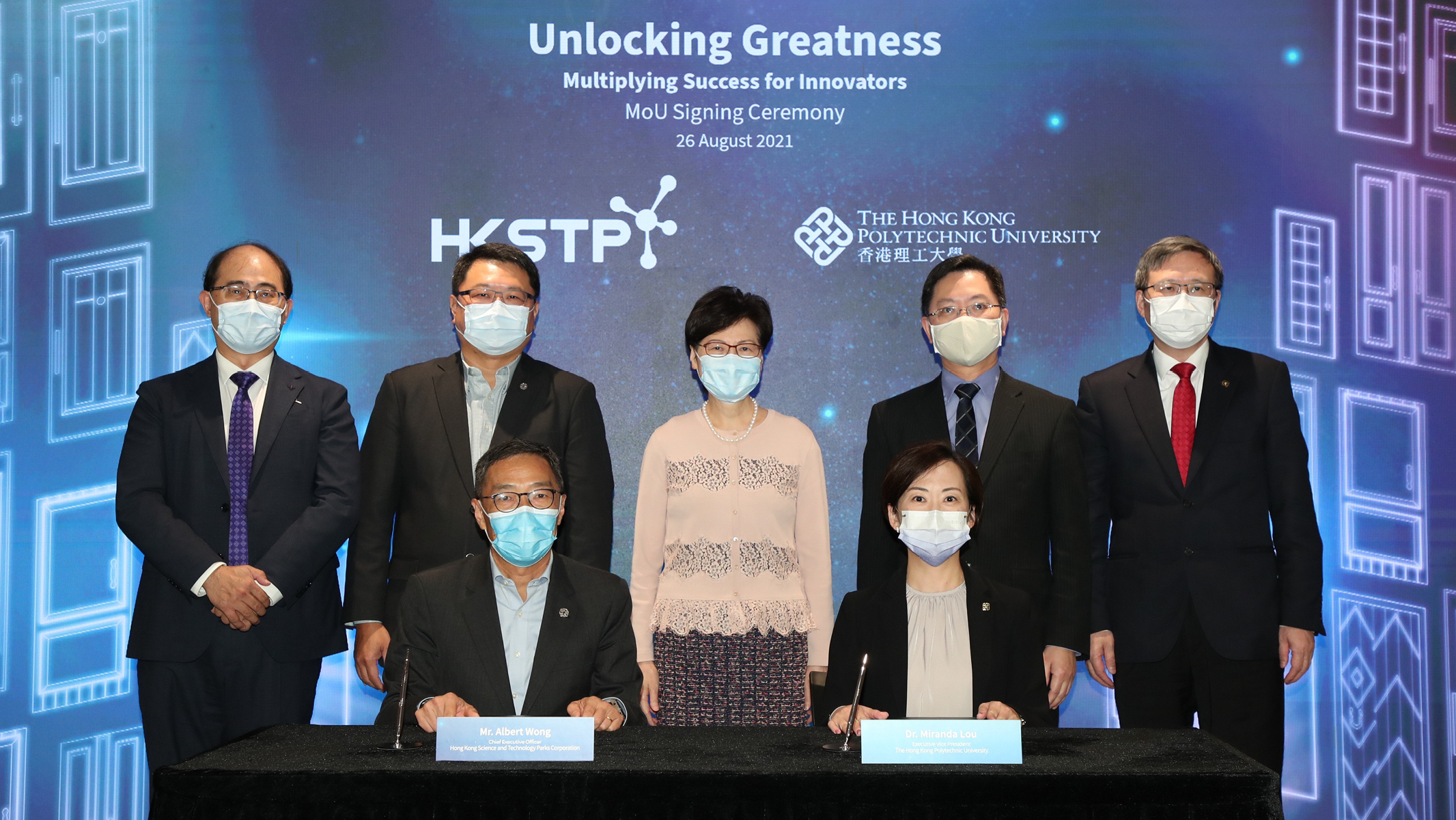 Dr Miranda Lou, Executive Vice President of PolyU (front row, right), and Mr Albert Wong, CEO of HKSTP (front row, left) signed an MOU to form a joint GBA-focused entrepreneurship programme to nurture young R&D talent to become tech entrepreneurs. The signing was witnessed by Mrs Carrie Lam, Chief Executive of HKSAR (back row, middle); Mr Alfred Sit, Secretary for Innovation and Technology (back row, second from right); Dr Sunny Chai, Chairman of HKSTP (back row, second from left); Professor Jin-Guang Teng, President of PolyU (back row, right) and Professor Wing-tak Wong, Deputy President and Provost of PolyU (back row, left).