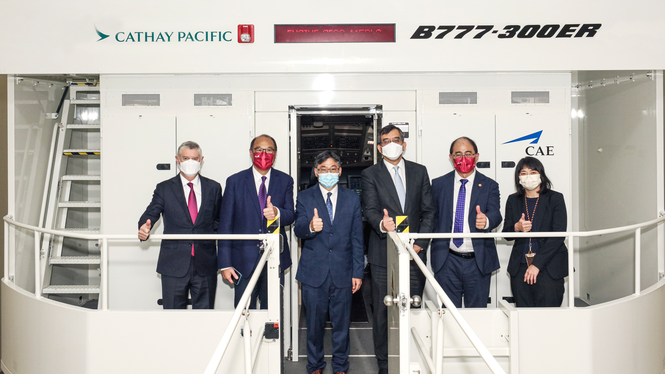 Secretary for Transport and Logistics Mr Lam Sai-hung (third, left), the Guest of Honour at the signing ceremony, pictured with Dr Lam Tai-fai (second, left), Mr Augustus Tang (third, right), Prof. Wing-tak Wong (second, right), CAD Assistant Director-General (Flight Standards) Ms Clara Wong (right) and Mr Greg Hughes (left).